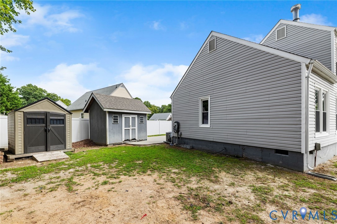 15908 Tri Gate Road Chester, VA 23831 - Photo 25 of 28 a view of a house with a yard
