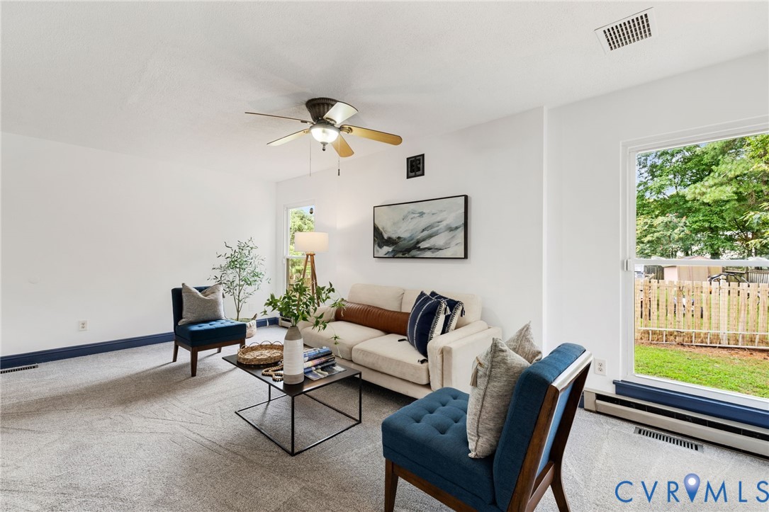 15908 Tri Gate Road Chester, VA 23831 - Photo 4 of 28 a living room with furniture a wooden floor and a window