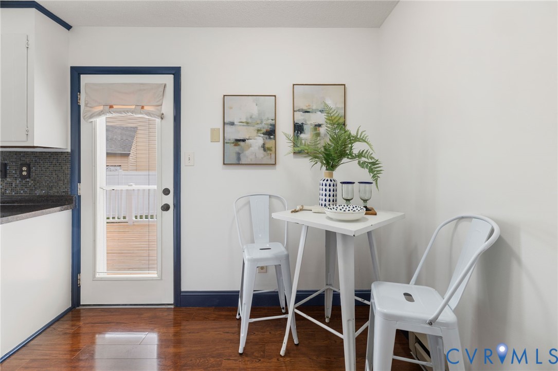 15908 Tri Gate Road Chester, VA 23831 - Photo 8 of 28 a view of a dining room with furniture and wooden floor
