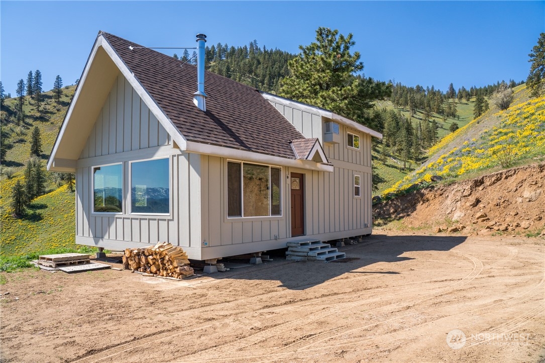 6734 Nahahum Canyon Road Cashmere, WA 98815 - Photo 2 of 32 a view of a house with a yard