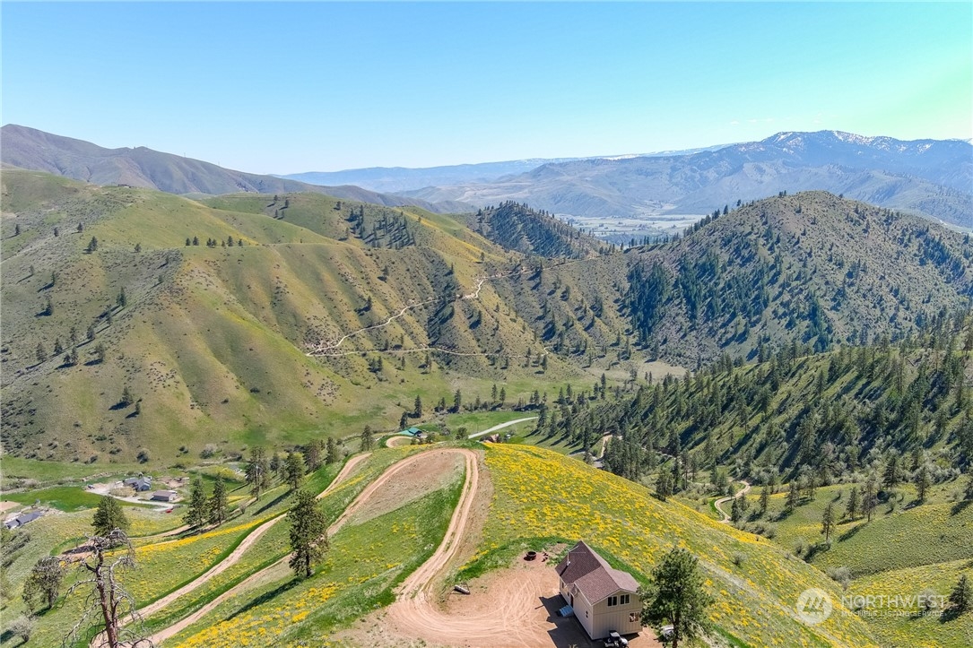 6734 Nahahum Canyon Road Cashmere, WA 98815 - Photo 5 of 32 a view of a backyard with a sink