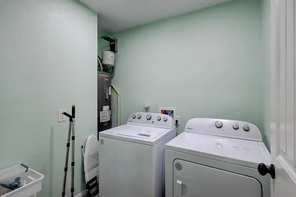 a utility room with dryer and washer