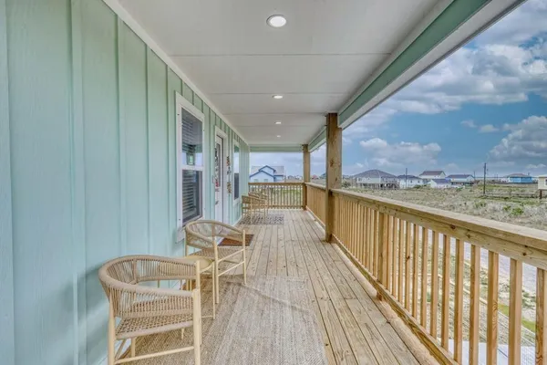 a view of a balcony with furniture