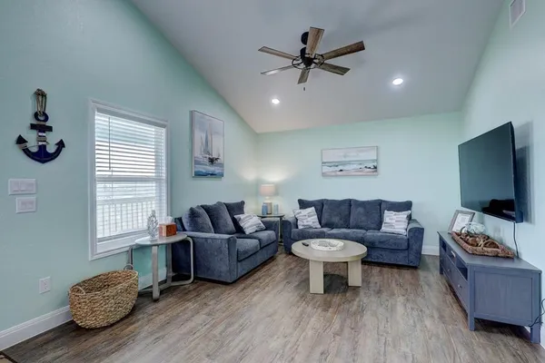 a living room with furniture and a flat screen tv