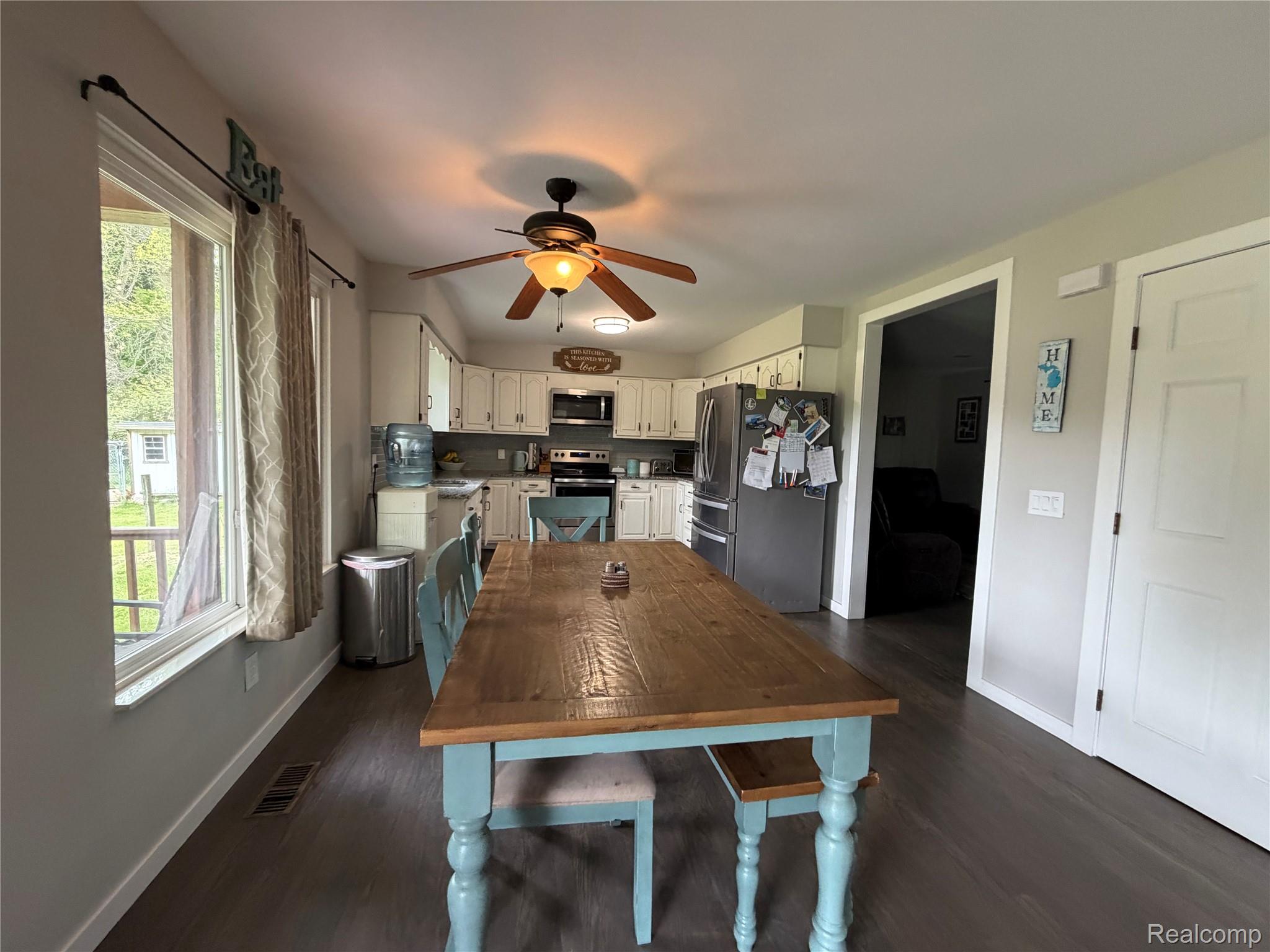2712 North Branch Road North Branch, MI 48461 - Photo 11 of 37 Dining space featuring ceiling fan and dark wood finished floors