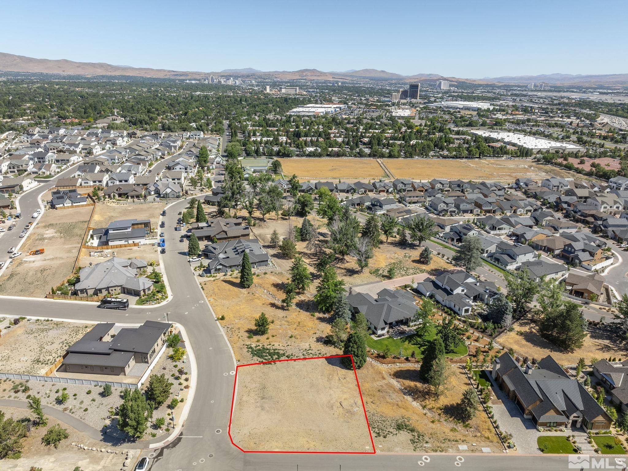 629 Silver Charm Way, Unit 7 Reno, NV 89511 - Photo 2 of 35 an aerial view of a city with lots of residential buildings