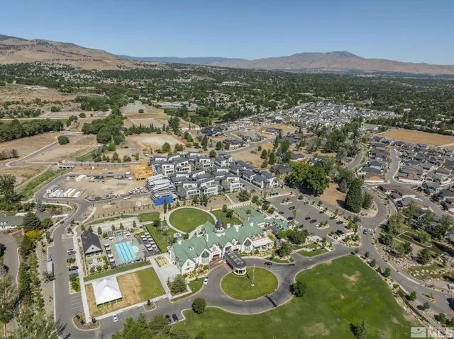 a view of multiple houses with a yard