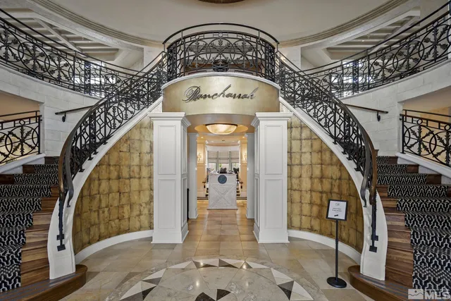 a view of building with garden in front of statue