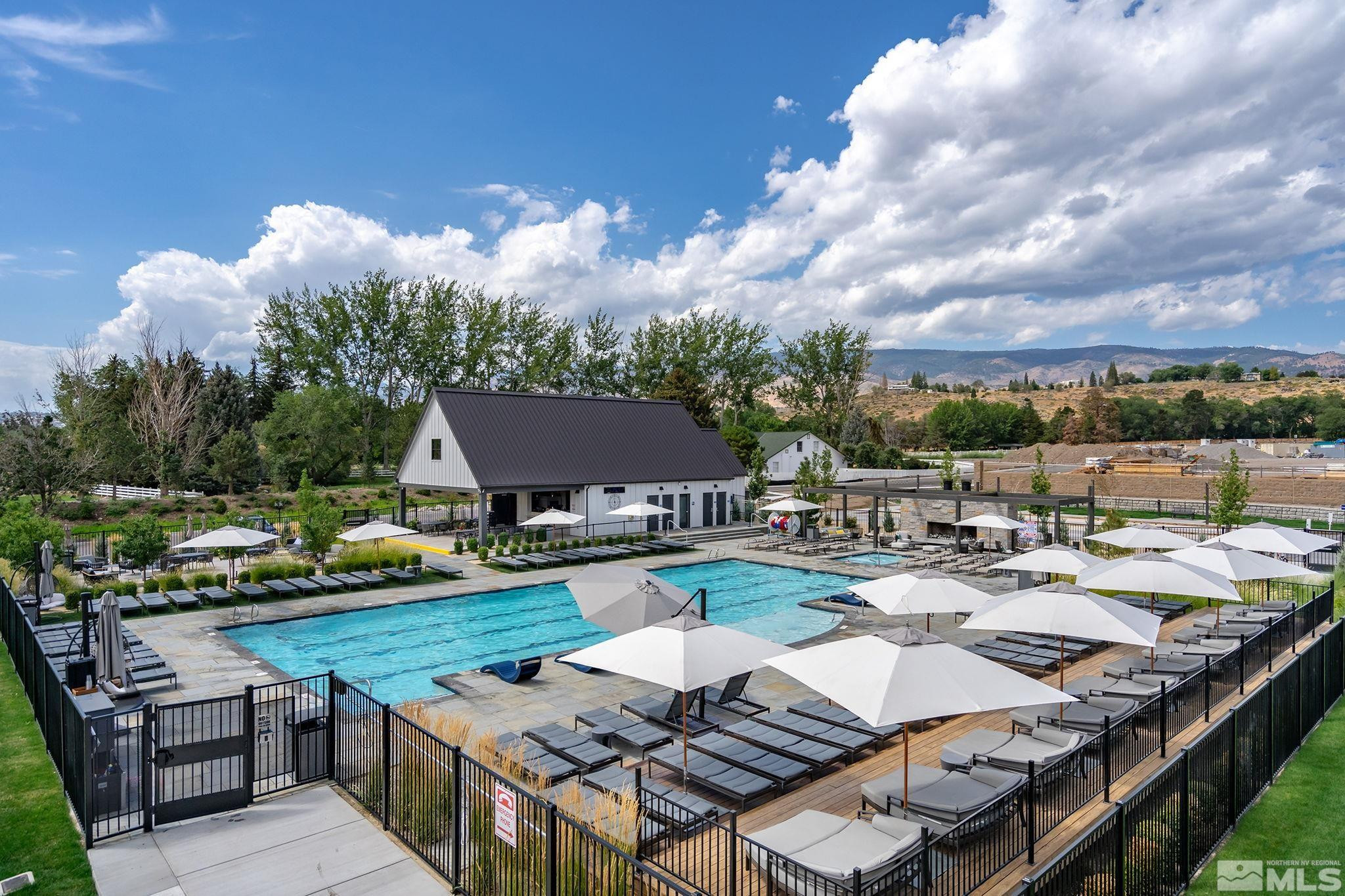 629 Silver Charm Way, Unit 7 Reno, NV 89511 - Photo 30 of 35 a view of a patio with chairs and a table