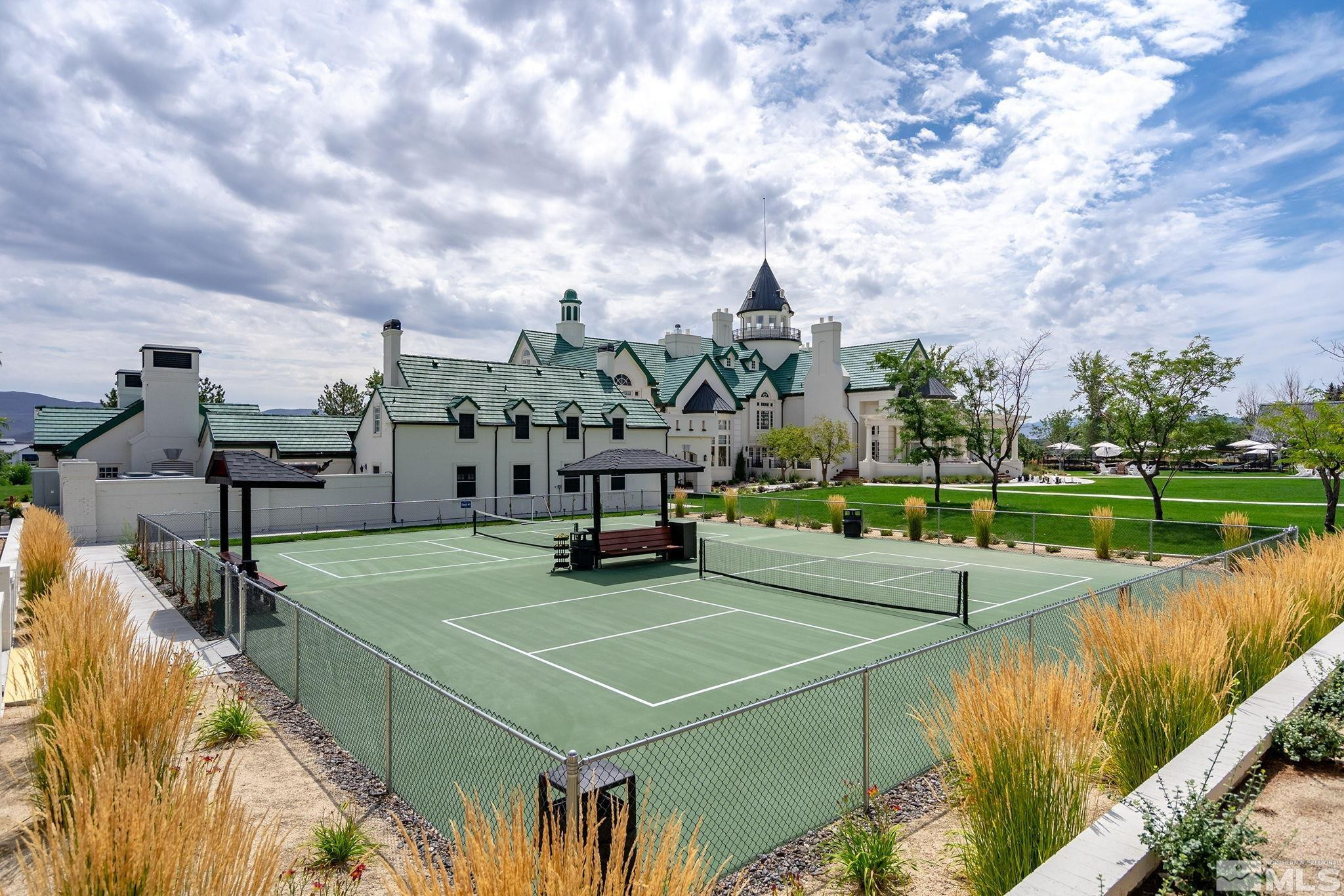 629 Silver Charm Way, Unit 7 Reno, NV 89511 - Photo 32 of 35 a view of a lake with a building in the background