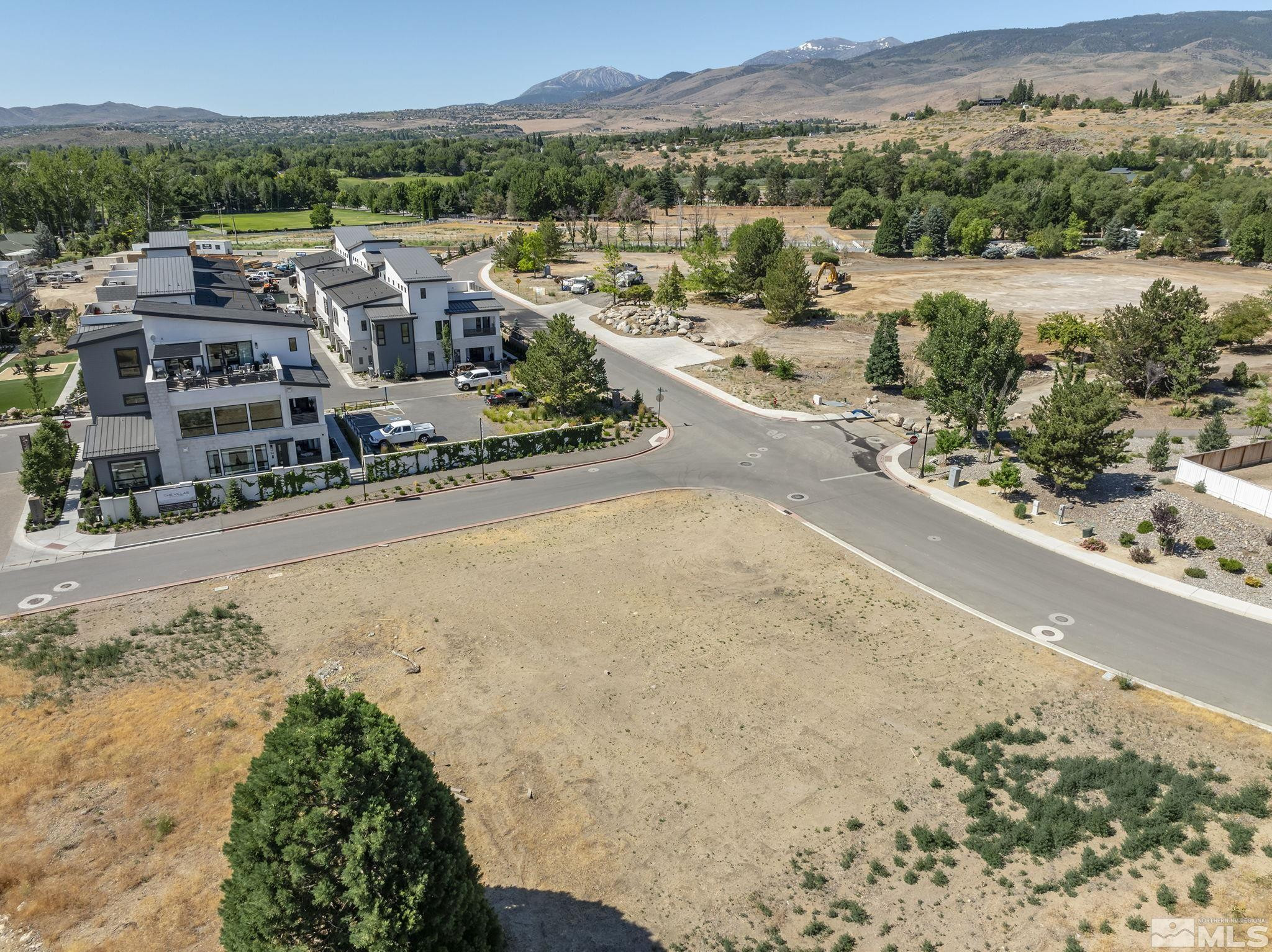 629 Silver Charm Way, Unit 7 Reno, NV 89511 - Photo 7 of 35 a view of a lake with a mountain