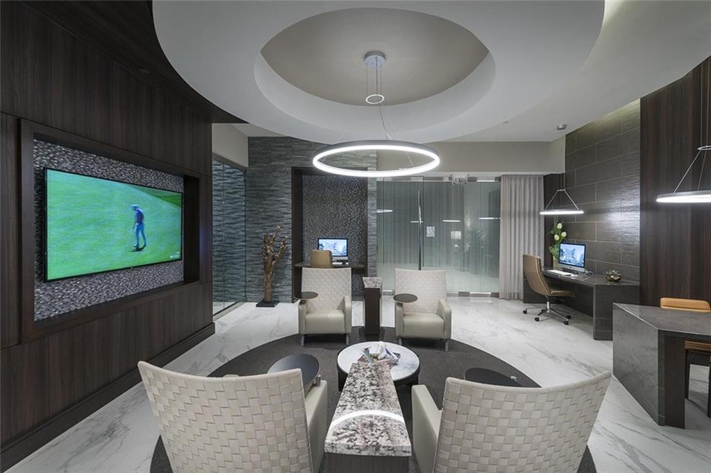 3150 Roswell Road Northwest, Unit 1410 Atlanta, GA 30305 - Photo 13 of 25 a living room with furniture and a flat screen tv