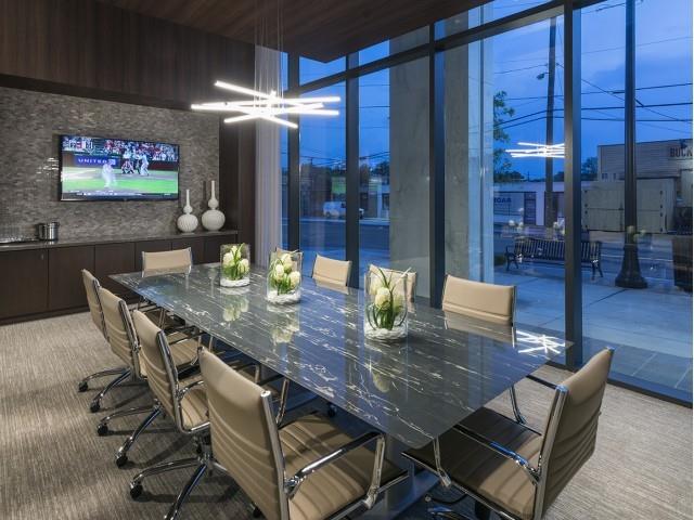 3150 Roswell Road Northwest, Unit 1410 Atlanta, GA 30305 - Photo 22 of 25 a dining room with furniture and wooden floor