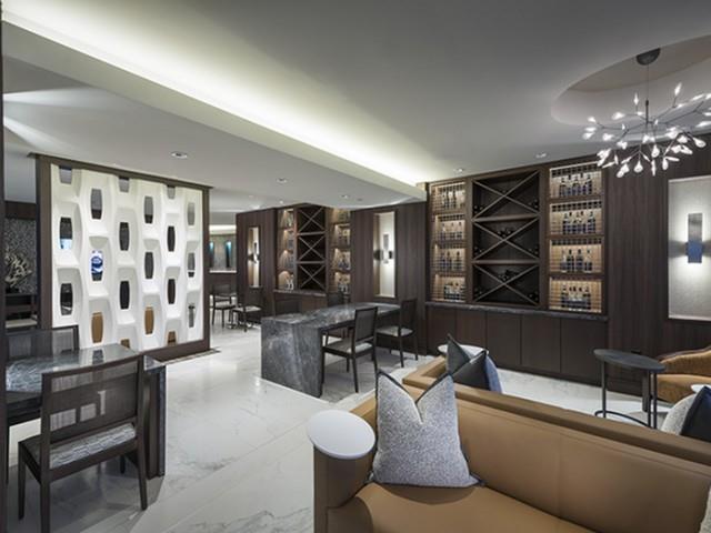 3150 Roswell Road Northwest, Unit 1410 Atlanta, GA 30305 - Photo 23 of 25 a living room with furniture a chandelier and a large window