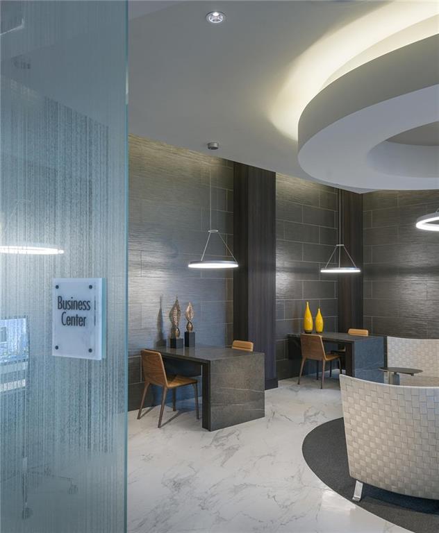 3150 Roswell Road Northwest, Unit 1410 Atlanta, GA 30305 - Photo 8 of 25 a living room with furniture and a table