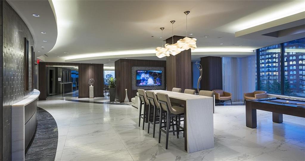 3150 Roswell Road Northwest, Unit 1410 Atlanta, GA 30305 - Photo 9 of 25 a view of a dining room with furniture and chandelier