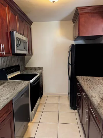 a kitchen with a stove and a microwave