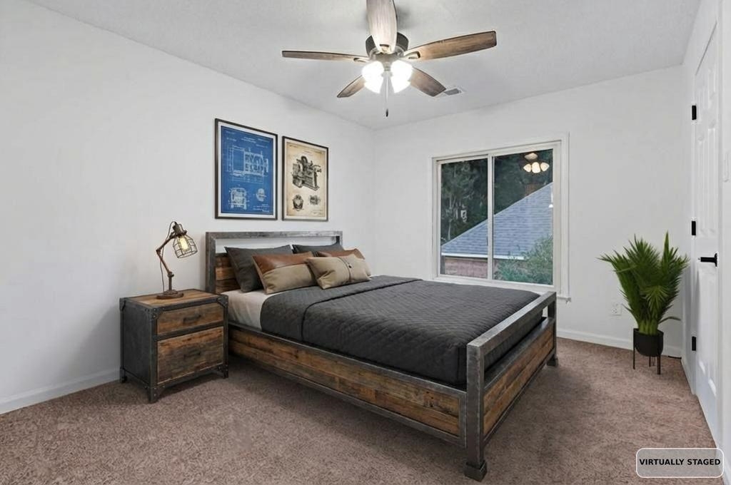 2389 Carrol Ridge Lane Cordova, TN 38016 - Photo 17 of 18 Carpeted bedroom with a ceiling fan and baseboards