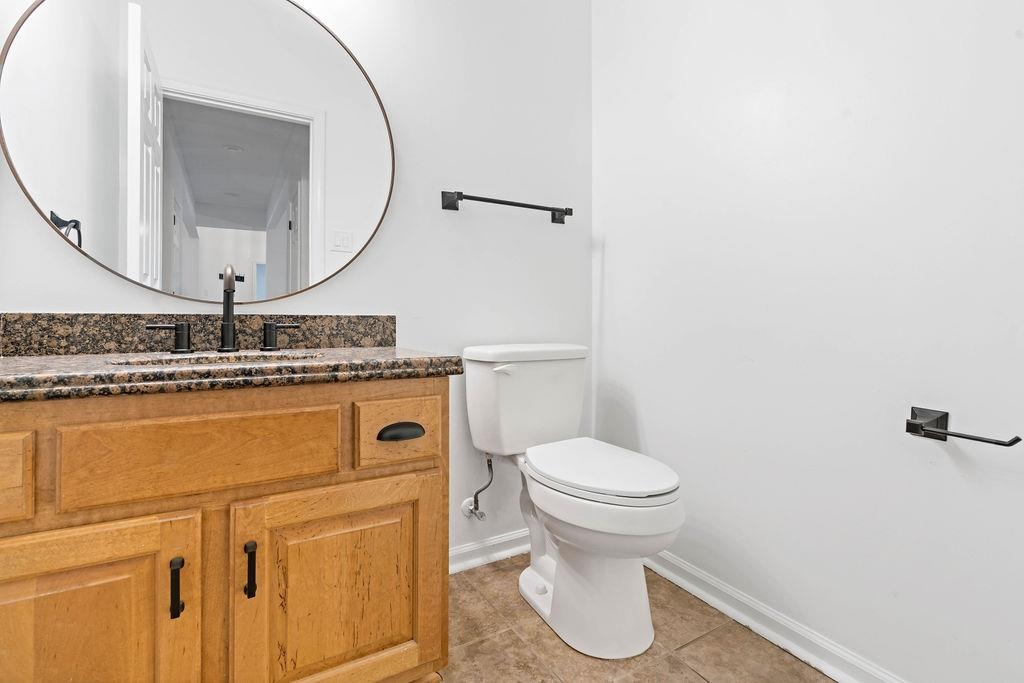 2389 Carrol Ridge Lane Cordova, TN 38016 - Photo 10 of 18 Half bath featuring vanity and light tile patterned flooring