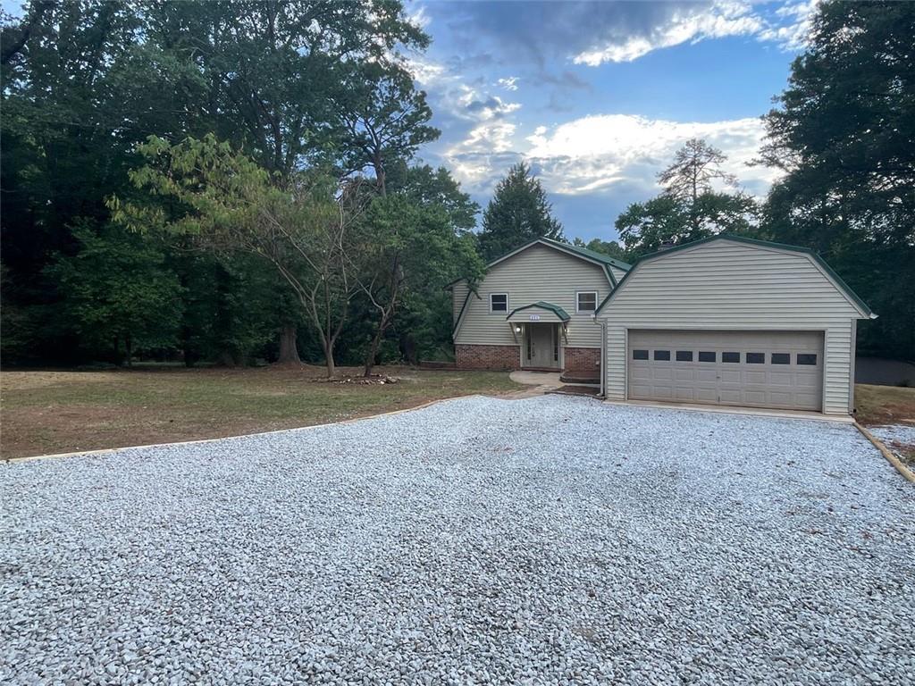 371 Oak Hill Road Covington, GA 30016 - Photo 1 of 1 a view of a house with a yard and large tree