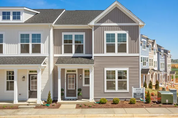 a front view of a house with a garage