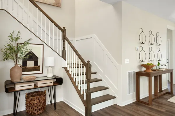 a view of entryway and hall with wooden floor