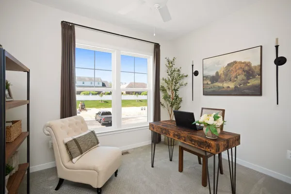a living room with furniture and a window