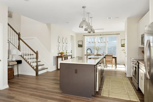 a view of a room with wooden floor and staircase