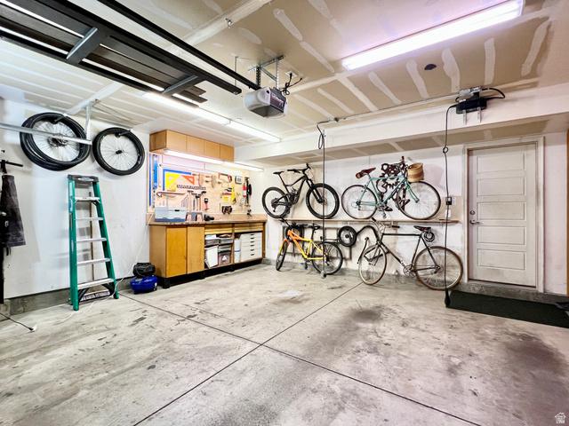 1017 South 275 West Logan, UT 84321 - Photo 29 of 36 Garage with a workshop area and a garage door opener