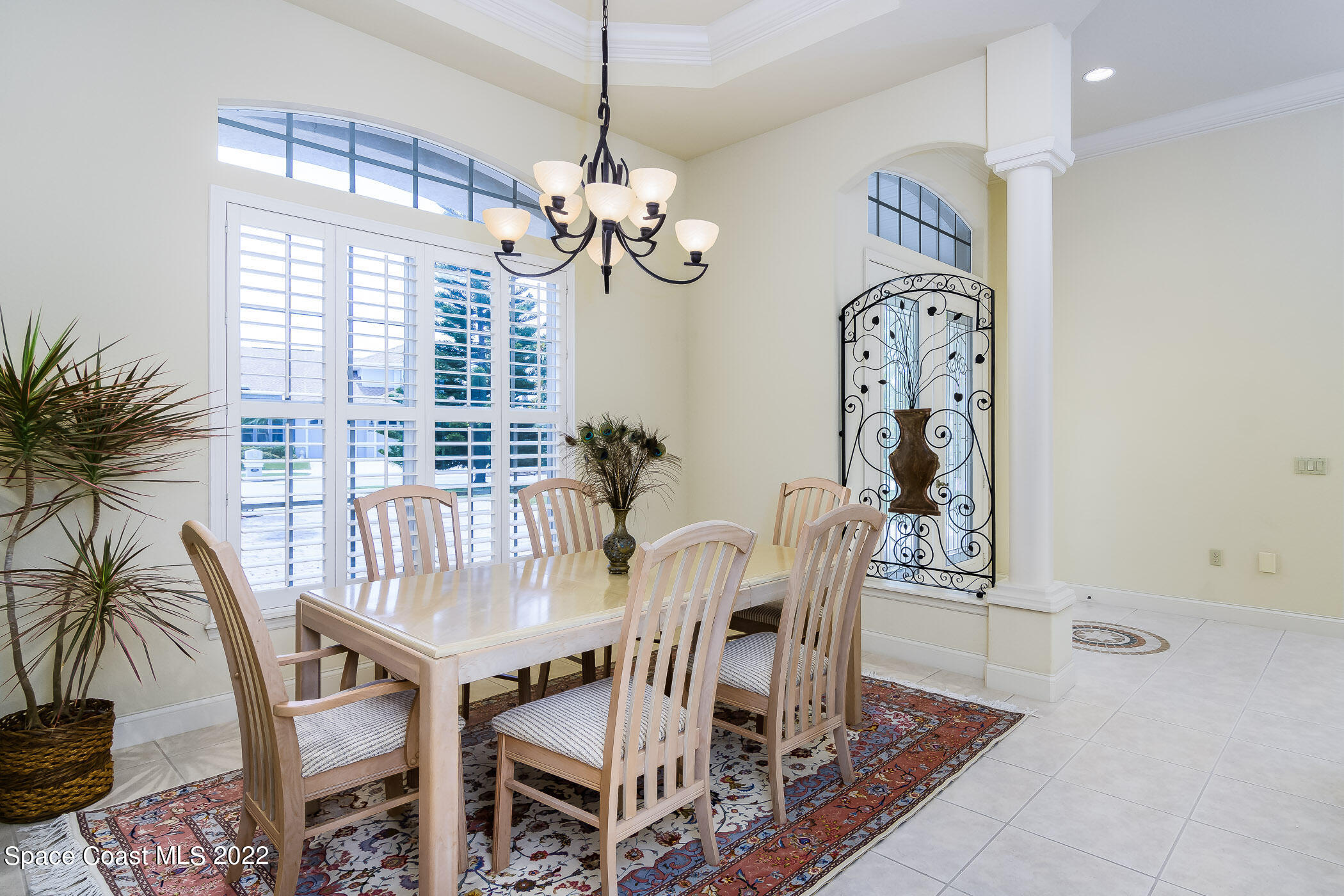 4251 Stoney Point Road Melbourne, FL 32940 - Photo 13 of 62 a view of a dining room with furniture window and wooden floor