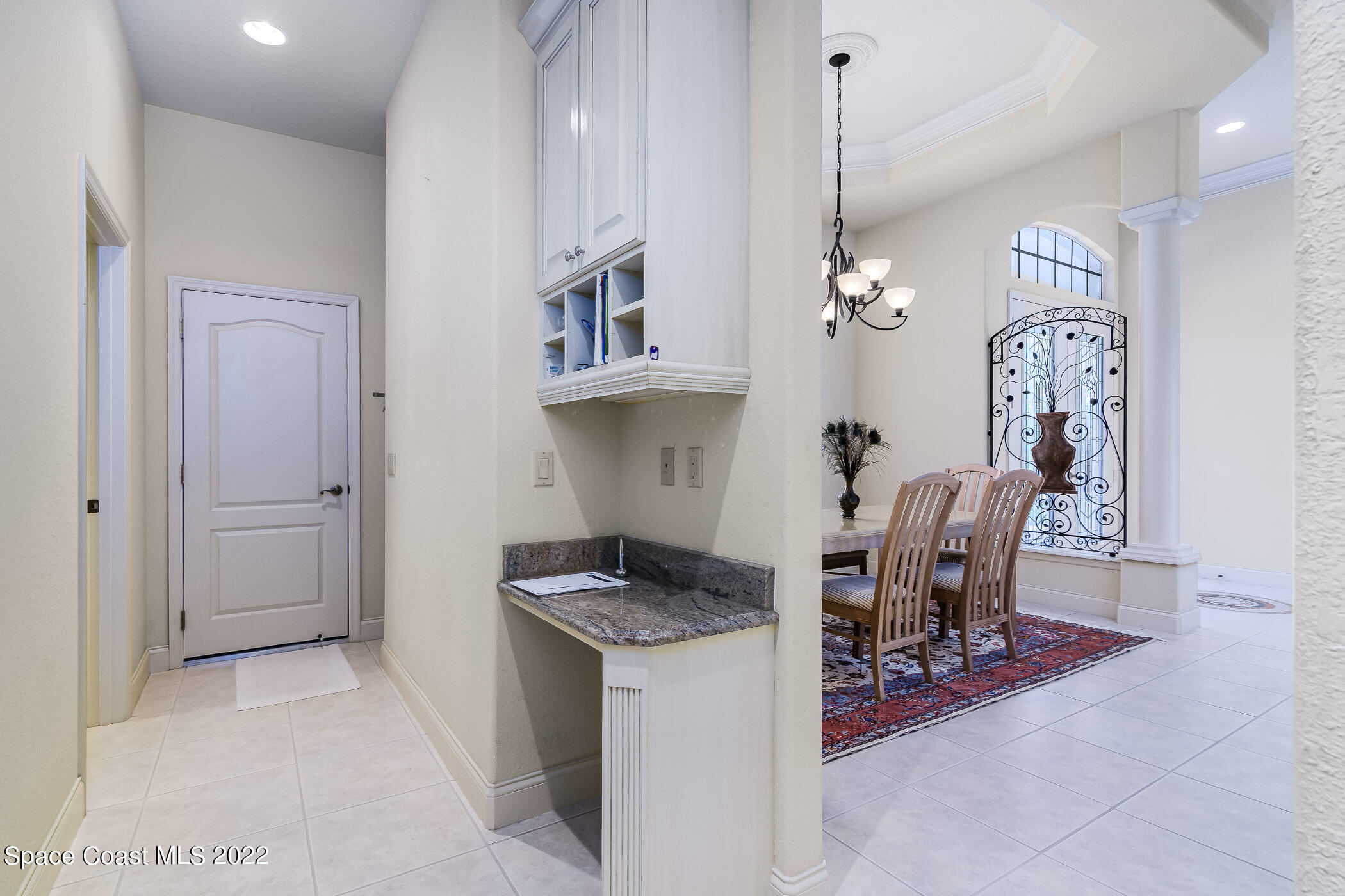 4251 Stoney Point Road Melbourne, FL 32940 - Photo 14 of 62 a view of a dining room with furniture and chandelier