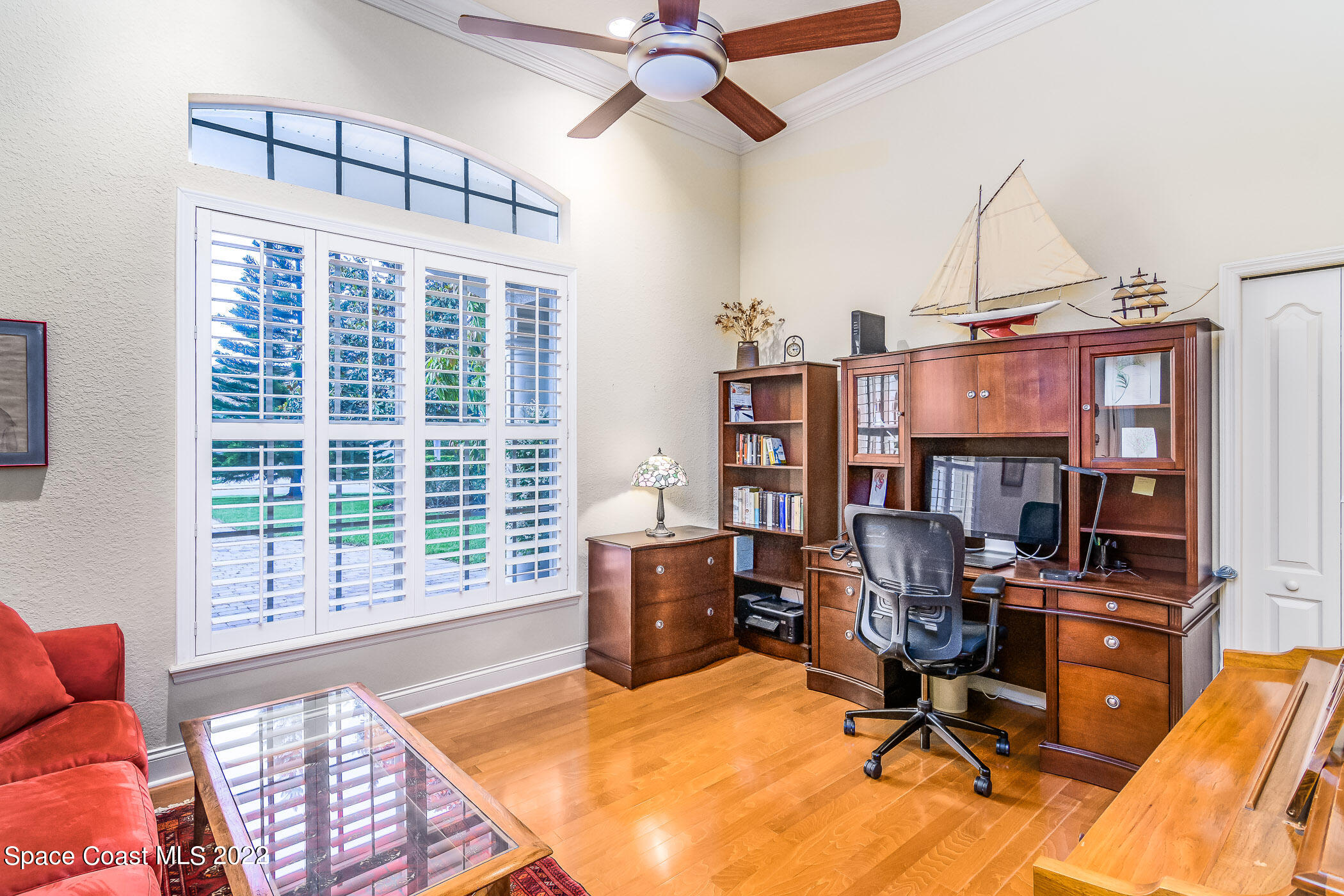 4251 Stoney Point Road Melbourne, FL 32940 - Photo 15 of 62 a view of a workspace with furniture and a window