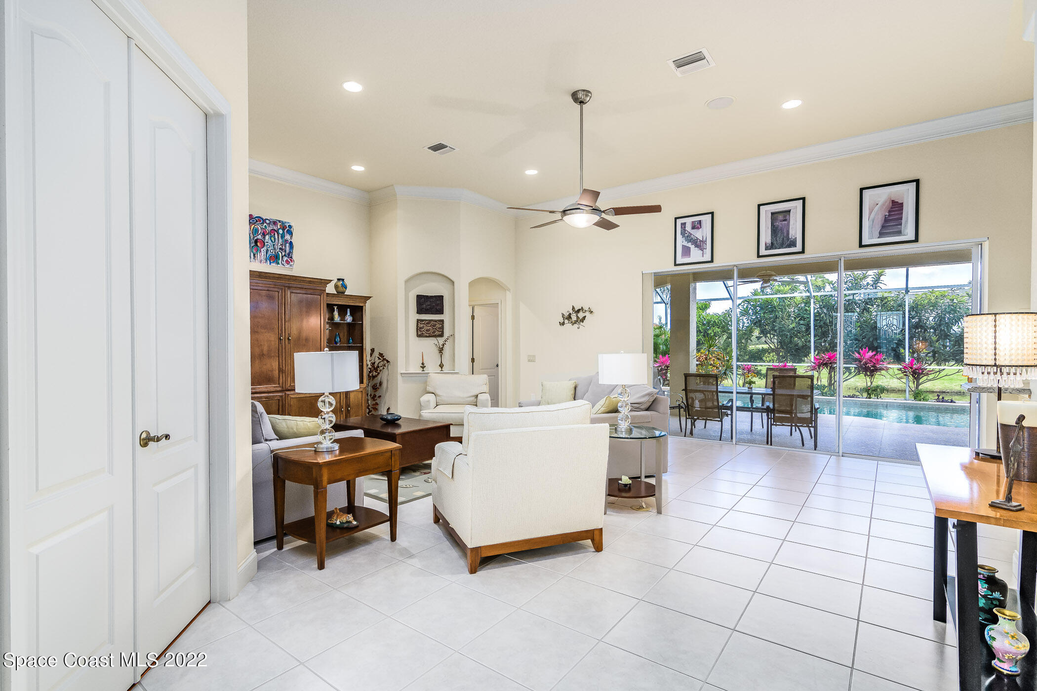 4251 Stoney Point Road Melbourne, FL 32940 - Photo 16 of 62 a living room with furniture and a flat screen tv