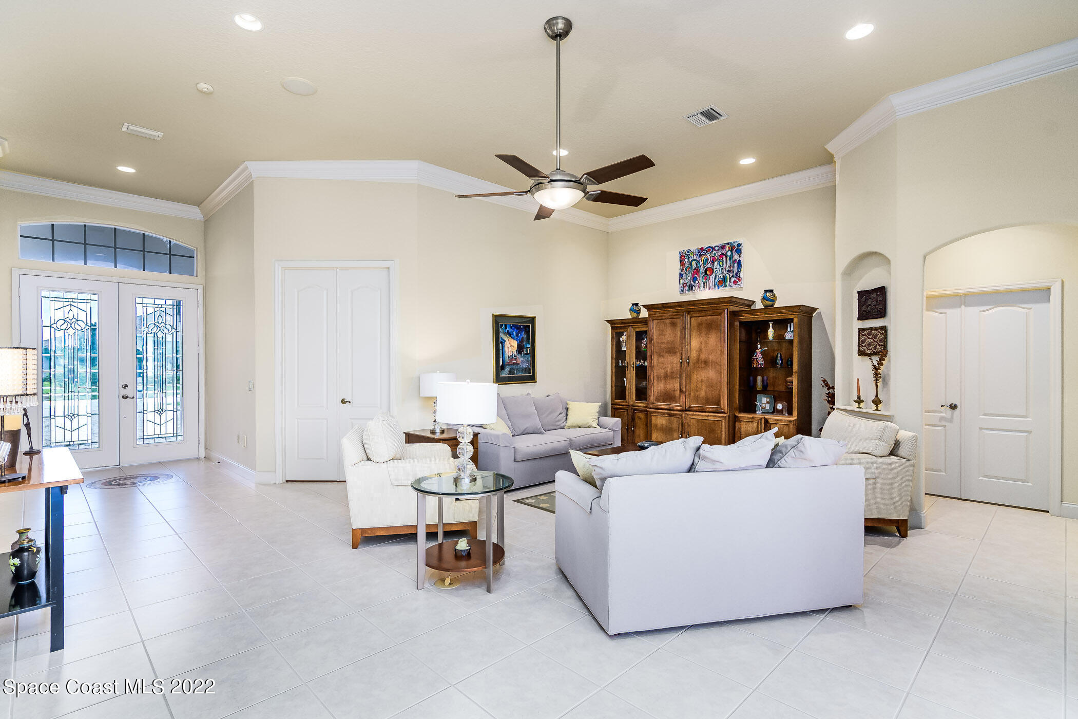 4251 Stoney Point Road Melbourne, FL 32940 - Photo 17 of 62 a living room with furniture and a chandelier
