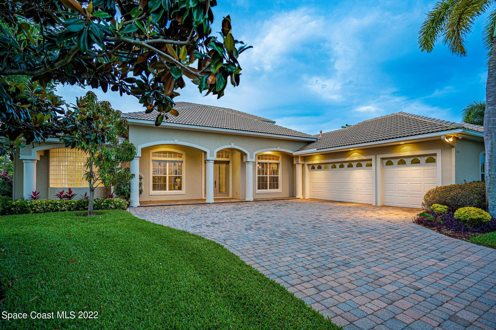 4251 Stoney Point Road Melbourne, FL 32940 - Photo 2 of 62 a front view of a house with garden