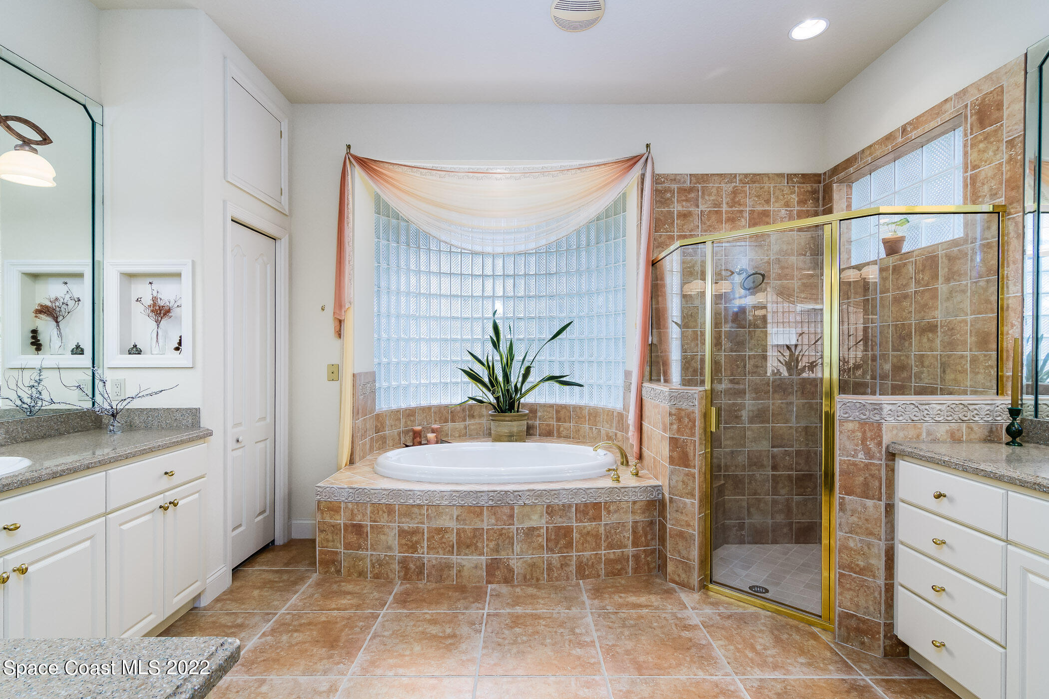 4251 Stoney Point Road Melbourne, FL 32940 - Photo 21 of 62 a bathroom with a granite countertop sink a toilet and shower