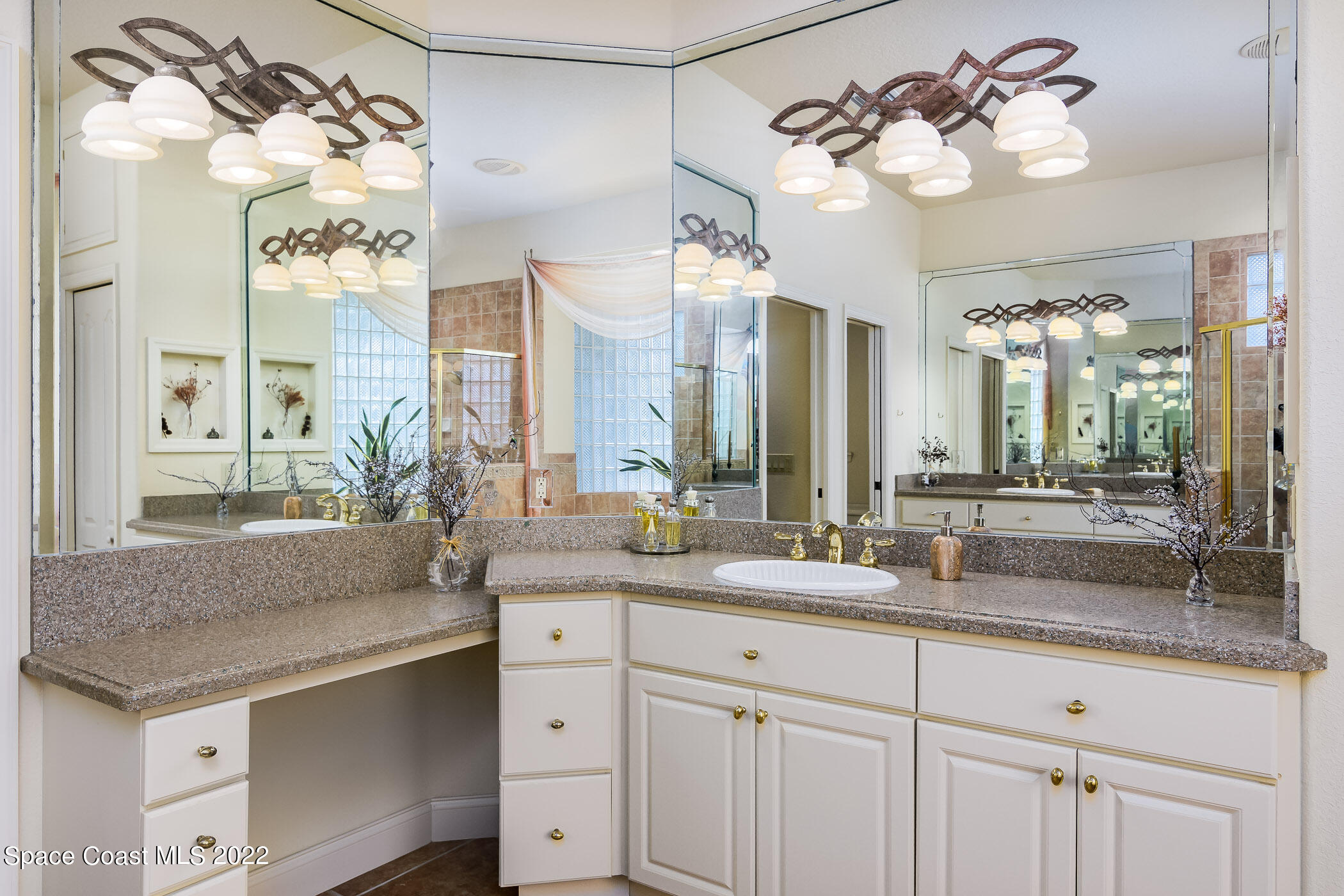 4251 Stoney Point Road Melbourne, FL 32940 - Photo 23 of 62 a bathroom with a double vanity sink and a mirror