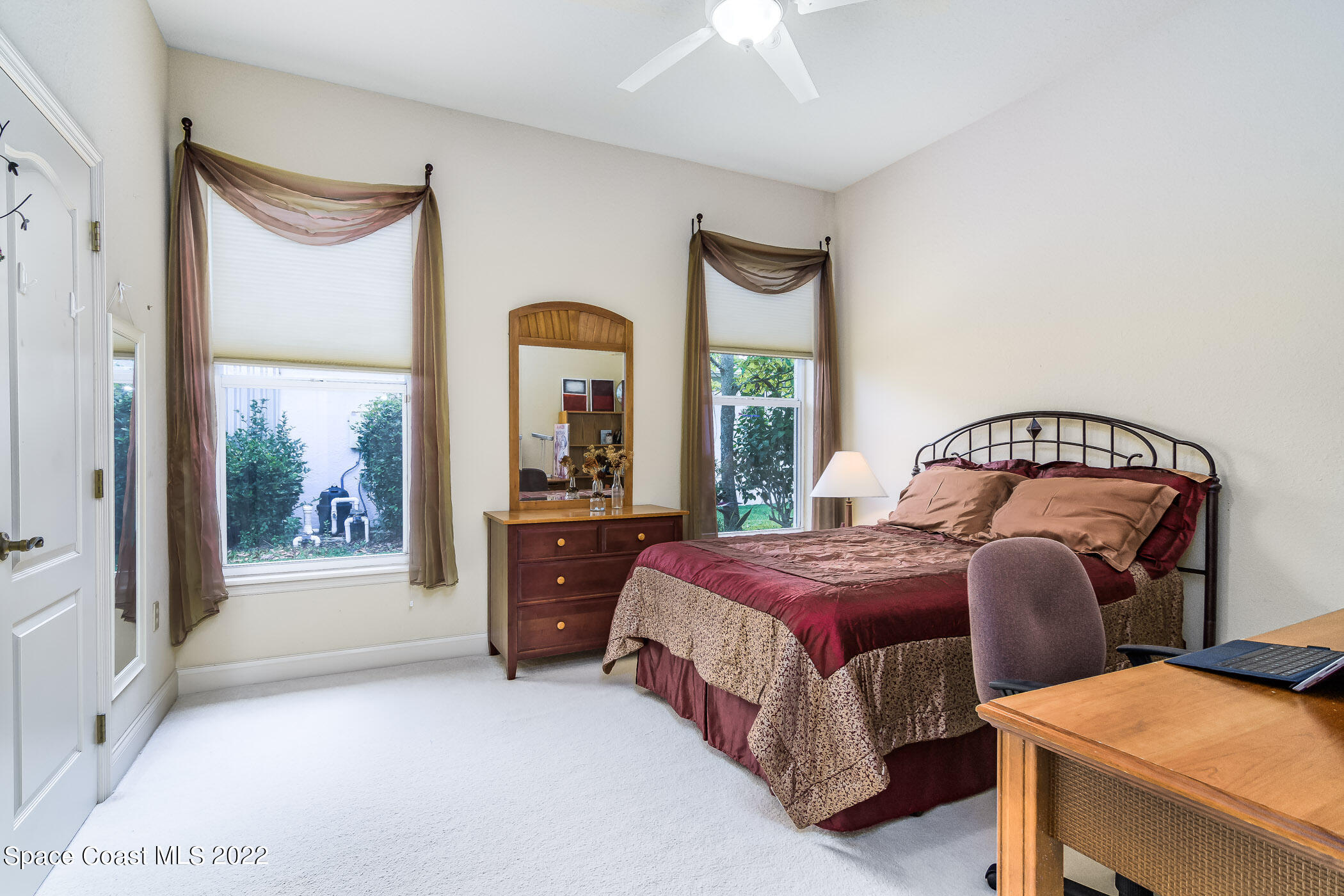 4251 Stoney Point Road Melbourne, FL 32940 - Photo 26 of 62 a bedroom with a bed and a window