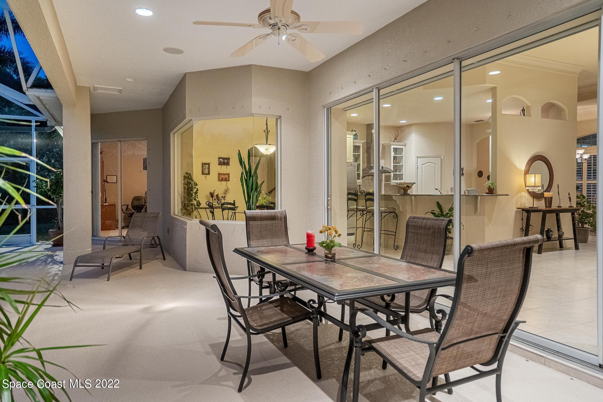 4251 Stoney Point Road Melbourne, FL 32940 - Photo 34 of 62 a dining room with furniture and window