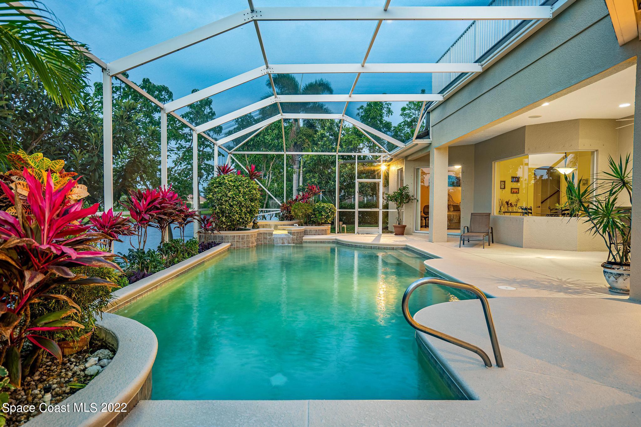 4251 Stoney Point Road Melbourne, FL 32940 - Photo 38 of 62 a view of a swimming pool with a porch