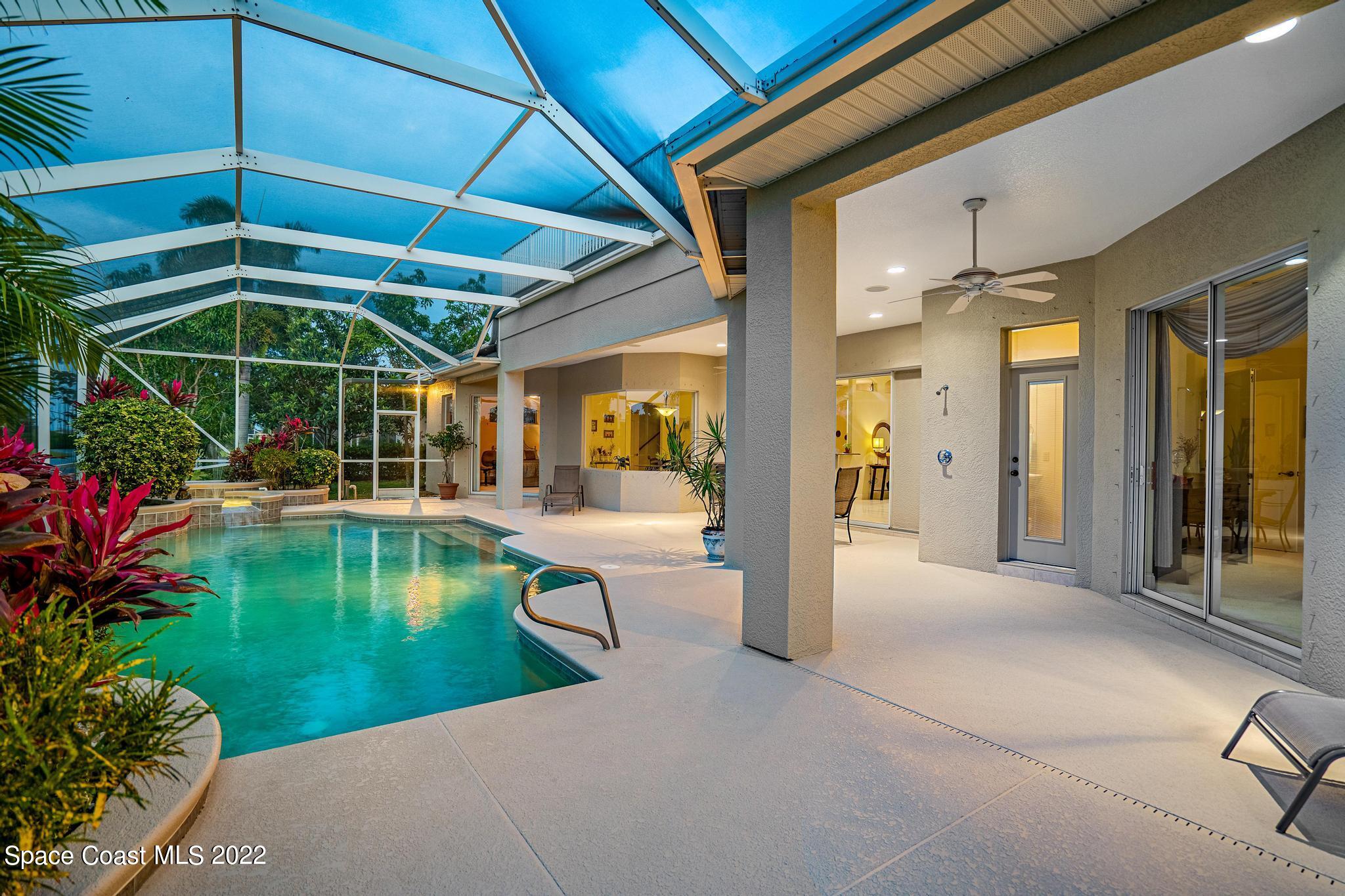 4251 Stoney Point Road Melbourne, FL 32940 - Photo 39 of 62 a view of a swimming pool with a patio