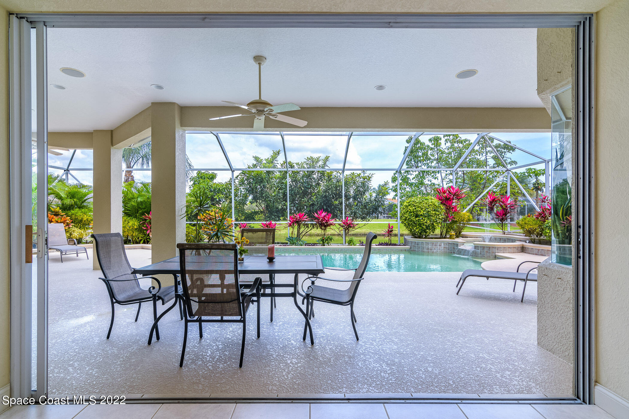 4251 Stoney Point Road Melbourne, FL 32940 - Photo 40 of 62 a view of a dining room with furniture wooden floor and garden view