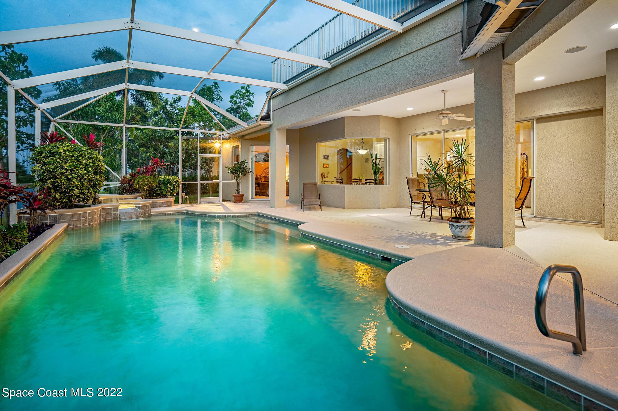 4251 Stoney Point Road Melbourne, FL 32940 - Photo 4 of 62 a view of a swimming pool with a patio