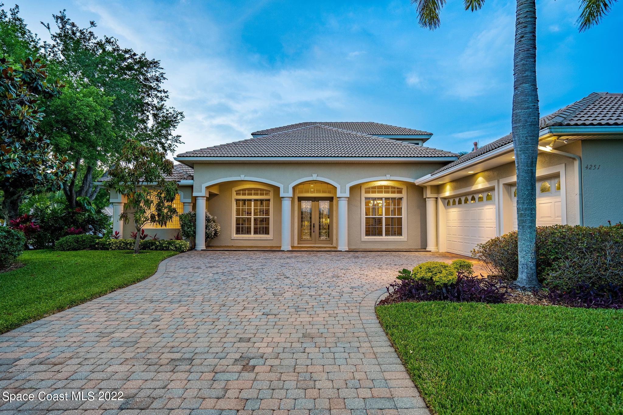 4251 Stoney Point Road Melbourne, FL 32940 - Photo 49 of 62 a front view of a house with garden
