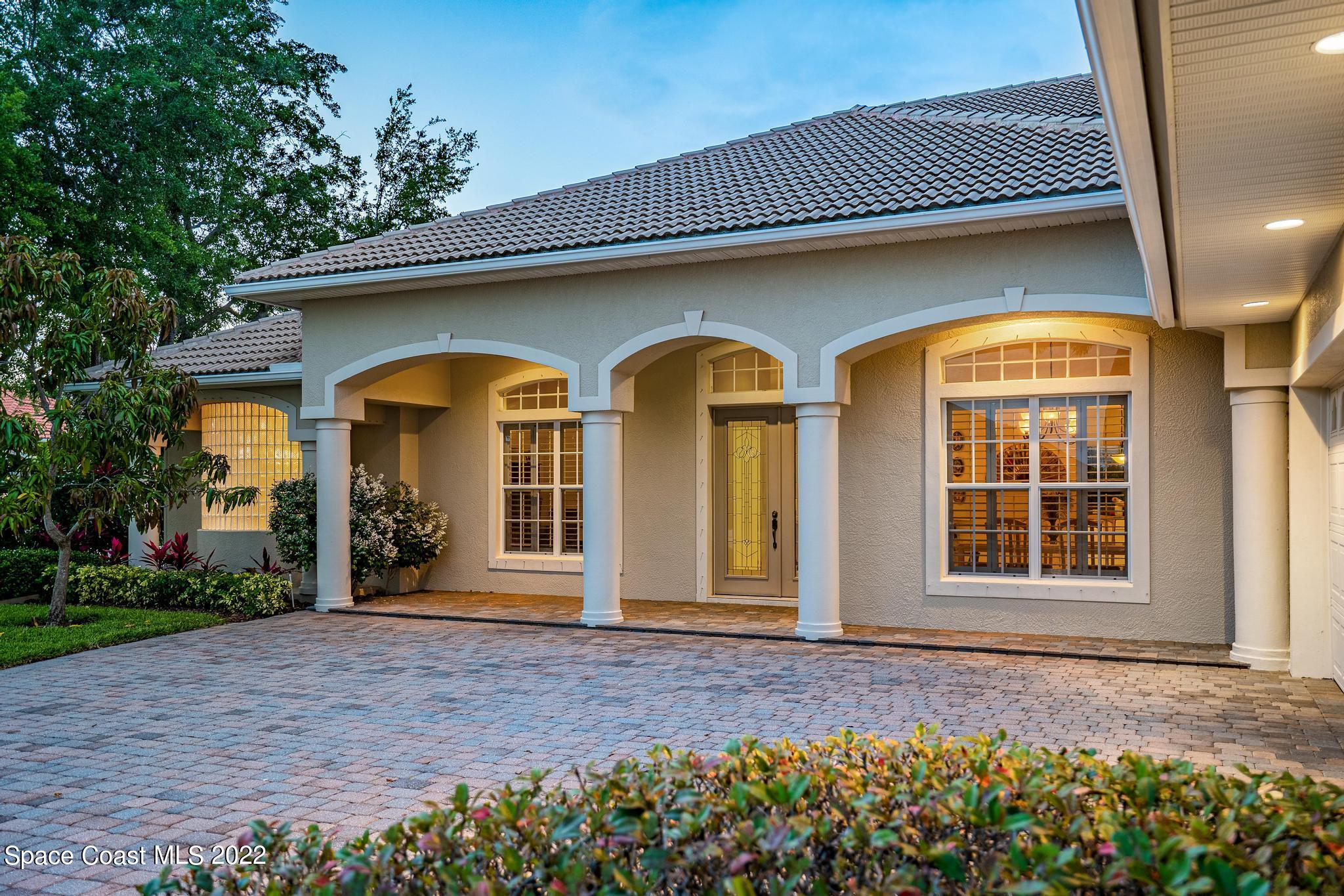 4251 Stoney Point Road Melbourne, FL 32940 - Photo 50 of 62 a front view of a house with garden