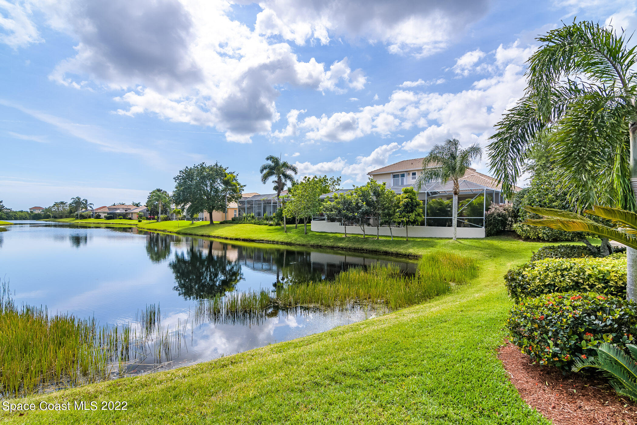 4251 Stoney Point Road Melbourne, FL 32940 - Photo 51 of 62 a view of a lake with houses in the background