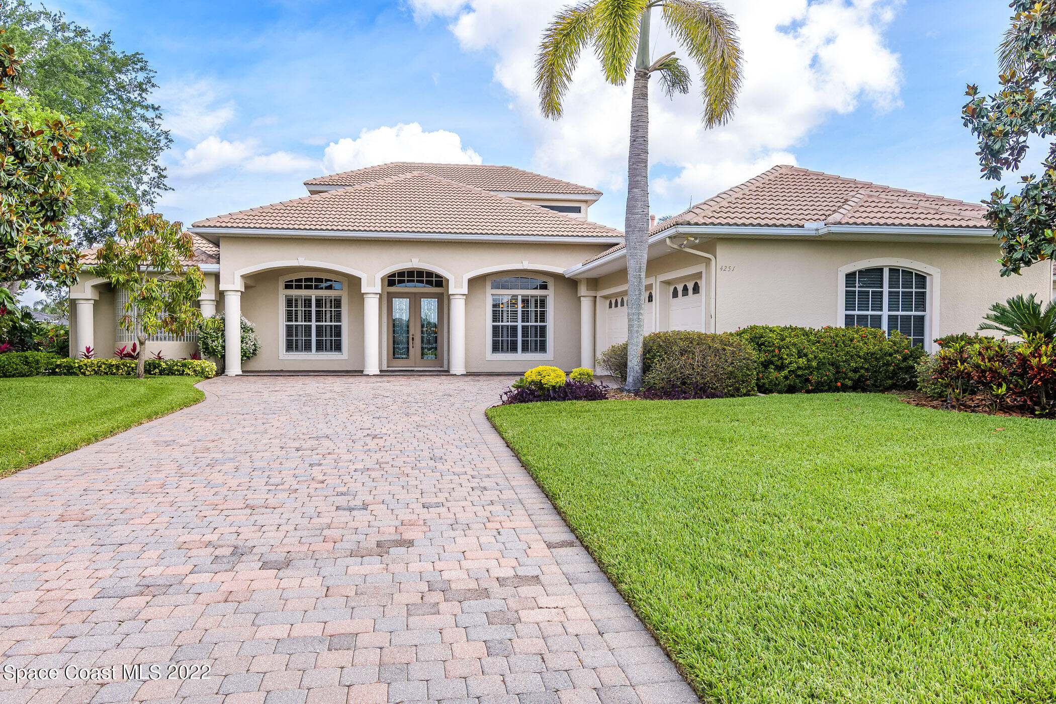 4251 Stoney Point Road Melbourne, FL 32940 - Photo 56 of 62 a front view of a house with garden