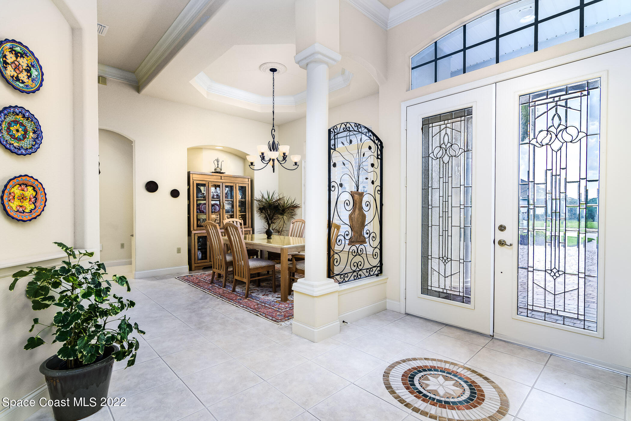 4251 Stoney Point Road Melbourne, FL 32940 - Photo 6 of 62 a view of entryway with a flower pot and a bookshelf