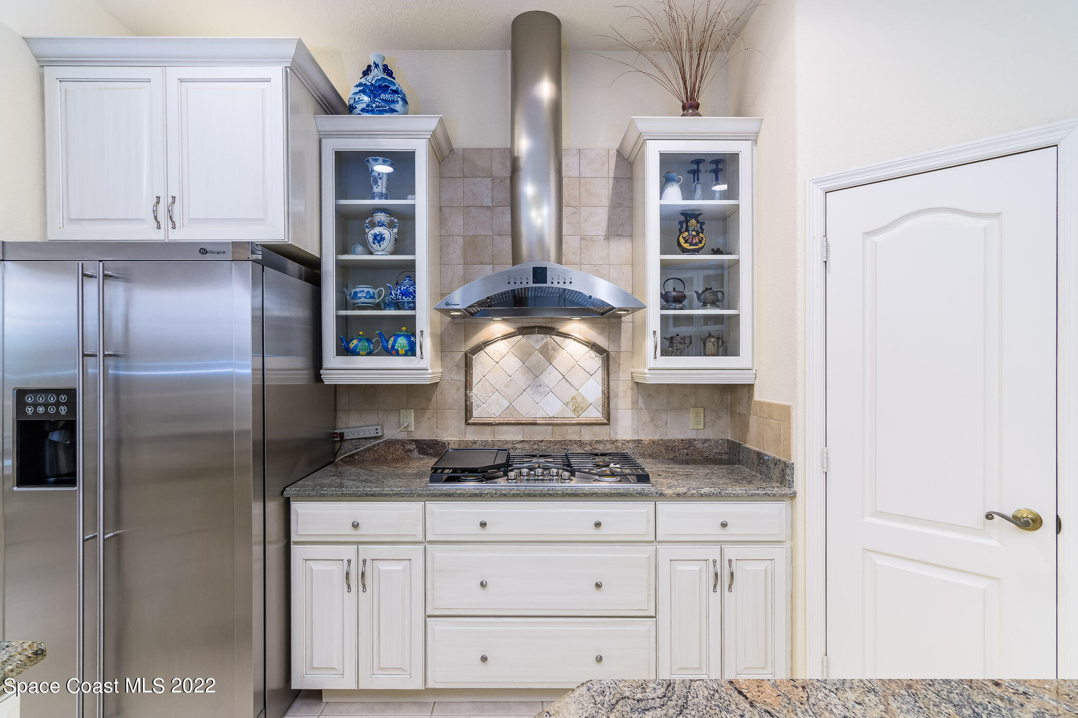 4251 Stoney Point Road Melbourne, FL 32940 - Photo 8 of 62 a kitchen with stainless steel appliances granite countertop a refrigerator and a stove
