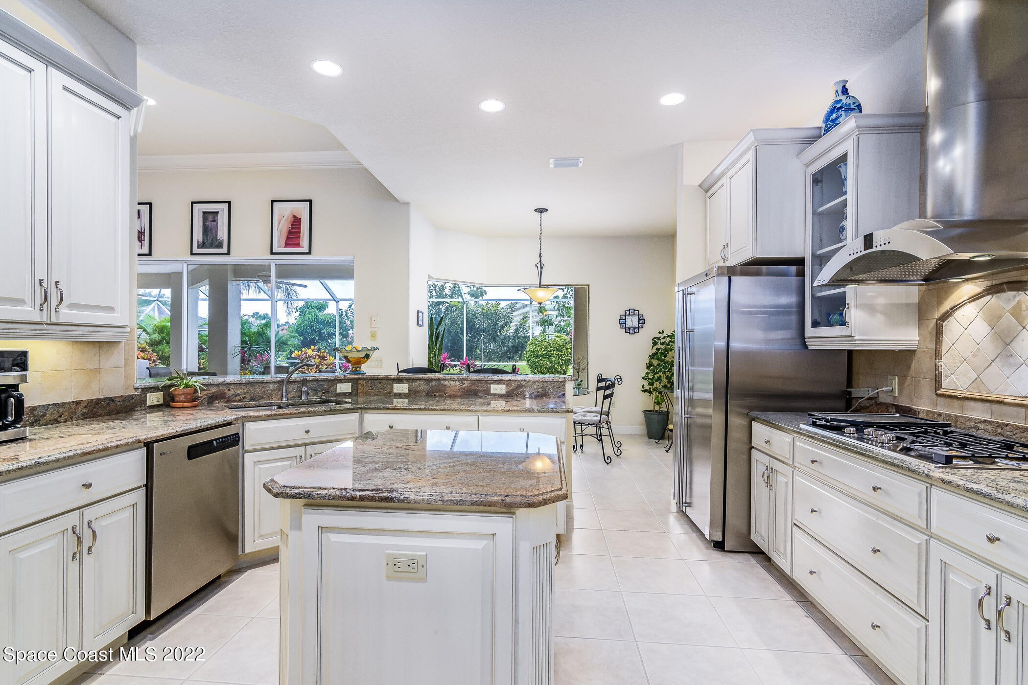 4251 Stoney Point Road Melbourne, FL 32940 - Photo 9 of 62 a kitchen with counter top space cabinets and appliances